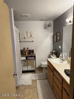 a living room with furniture plant and a window