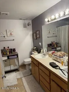 a living room filled with furniture and a flat screen tv