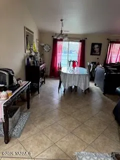 a room with furniture projector and screen