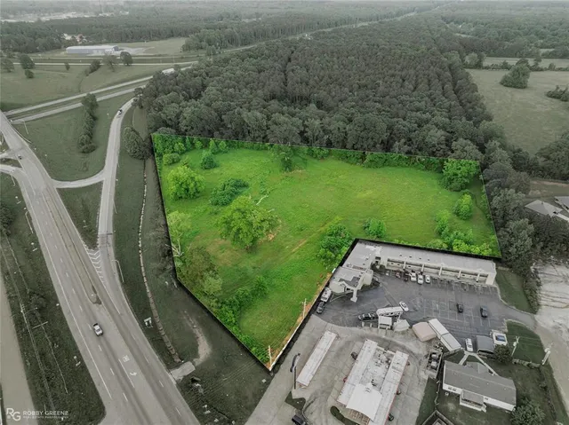 an aerial view of a residential houses with outdoor space