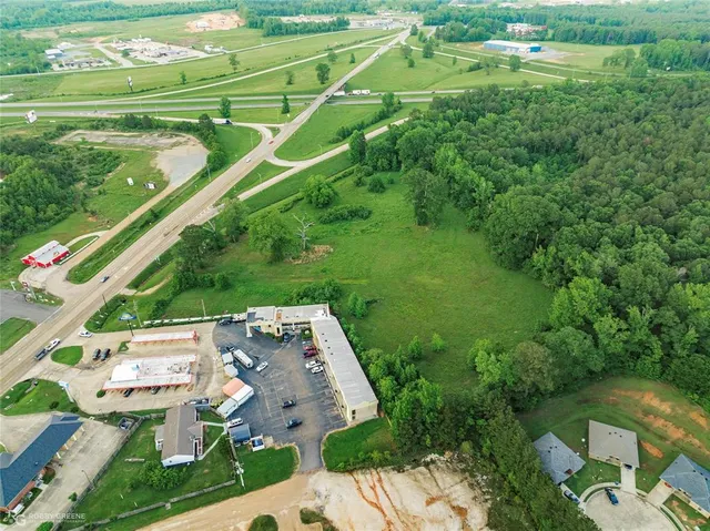 an aerial view of a residential houses with outdoor space and street view