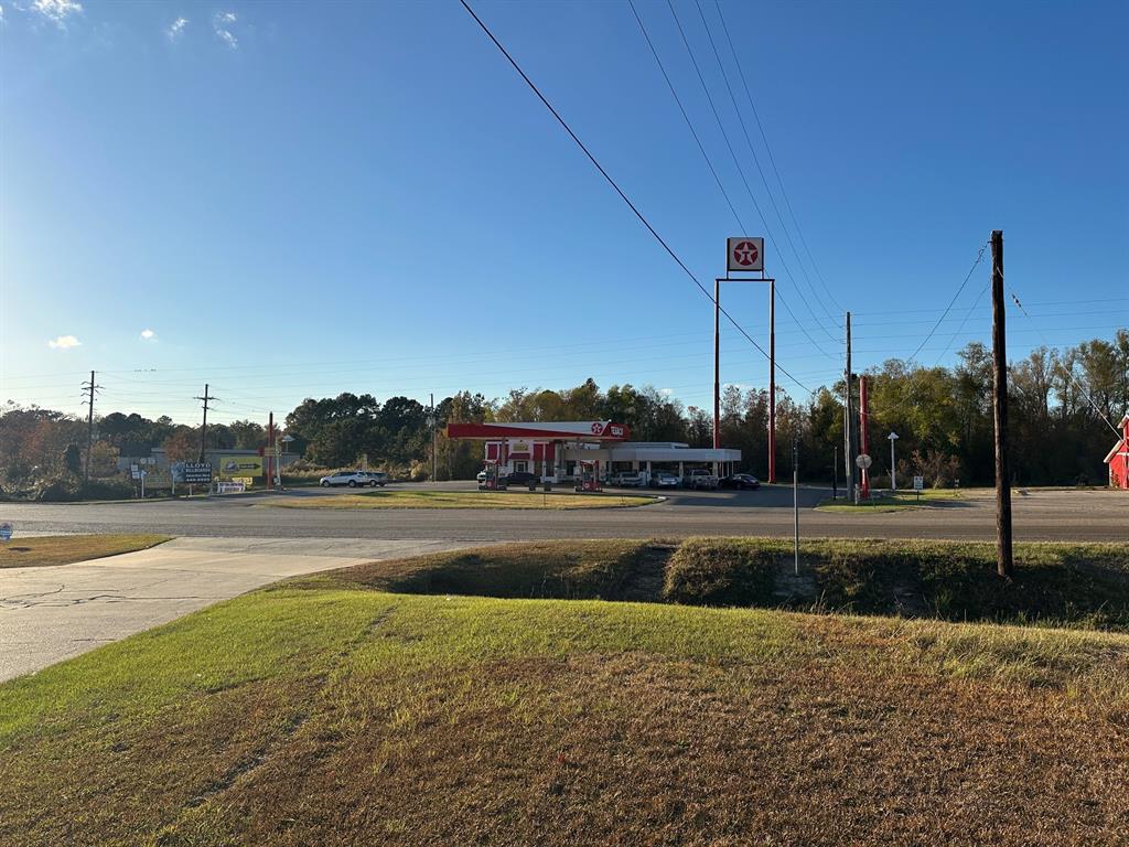 0 Hazel Street Arcadia, LA 71001 - Photo 8 of 17 a view of a lake with a house and a big yard