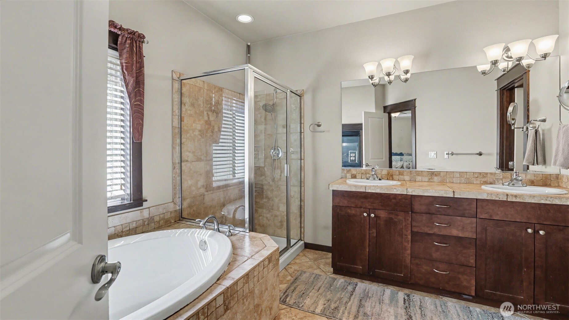 1357 Elma Place Northeast Renton, WA 98059 - Photo 18 of 40 a bathroom with a granite countertop tub sink and mirror