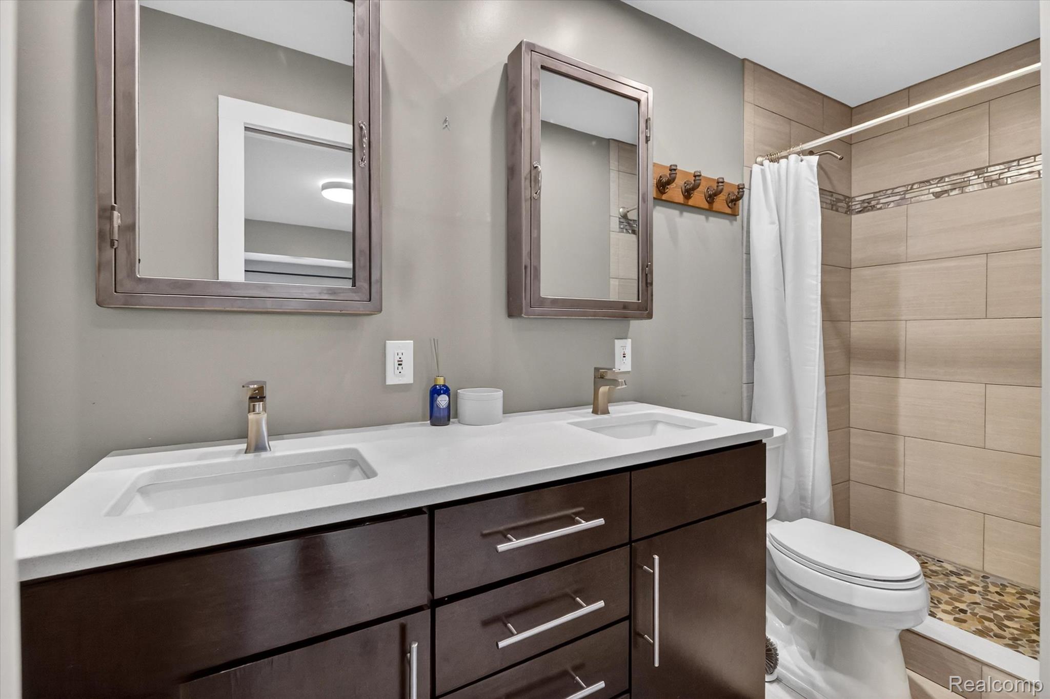 2264 Crane Road Fenton, MI 48430 - Photo 29 of 55 Bathroom featuring double vanity and a stall shower
