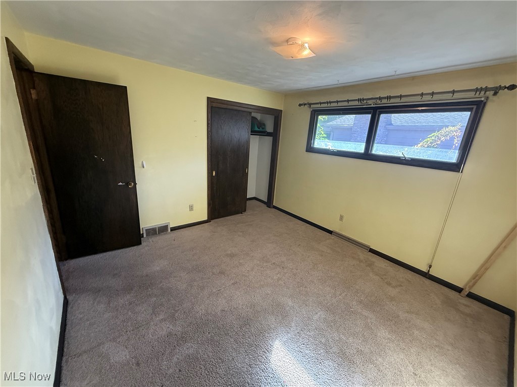 683 Robinson Road Campbell, OH 44405 - Photo 20 of 23 Unfurnished bedroom with a closet and carpet
