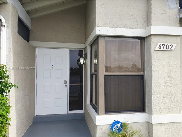 a view of a lake with houses in the back