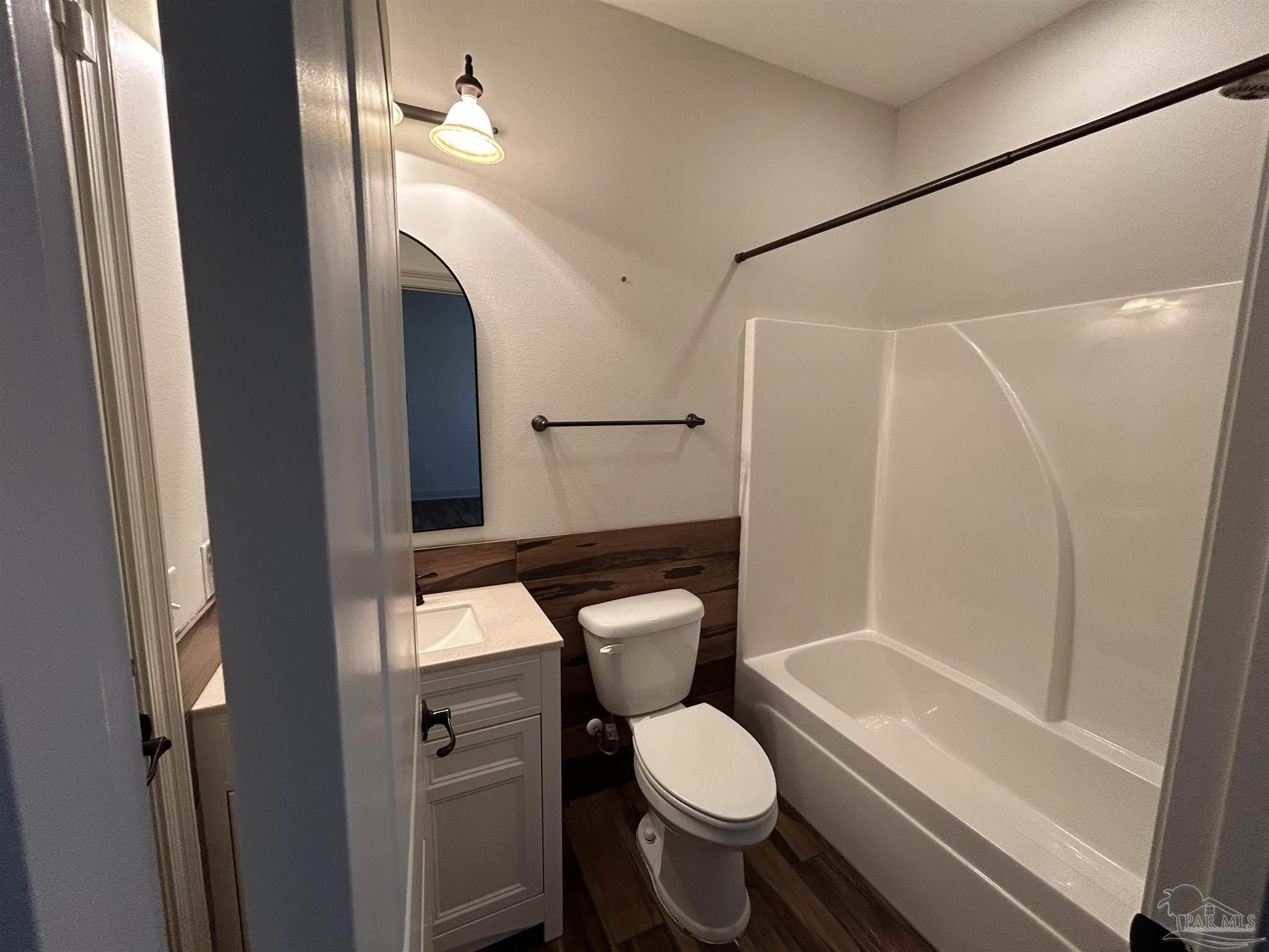 4081 Manchester Court Pace, FL 32571 - Photo 12 of 34 a bathroom with a toilet and a shower