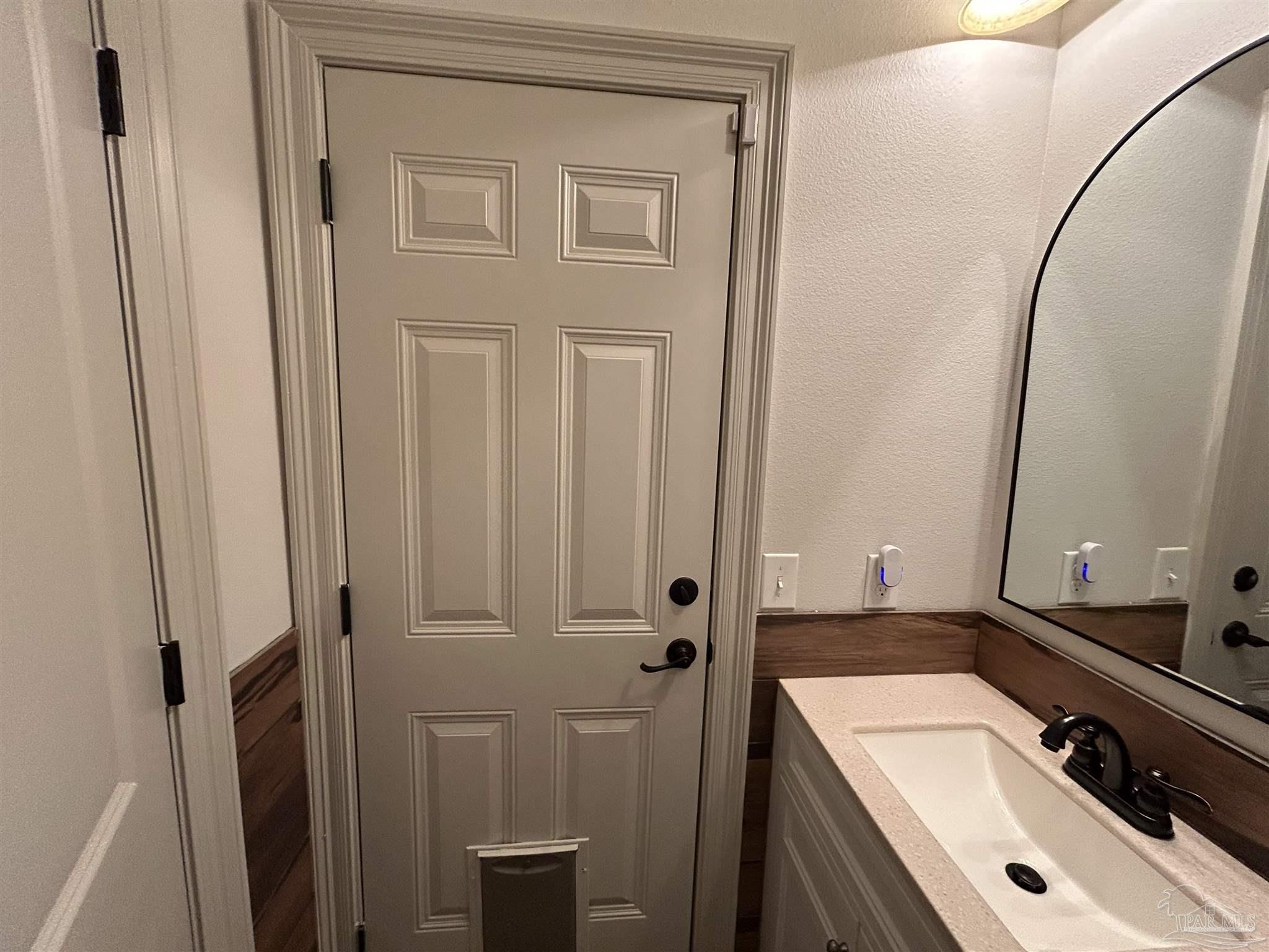4081 Manchester Court Pace, FL 32571 - Photo 13 of 34 a bathroom with a sink a toilet and shower