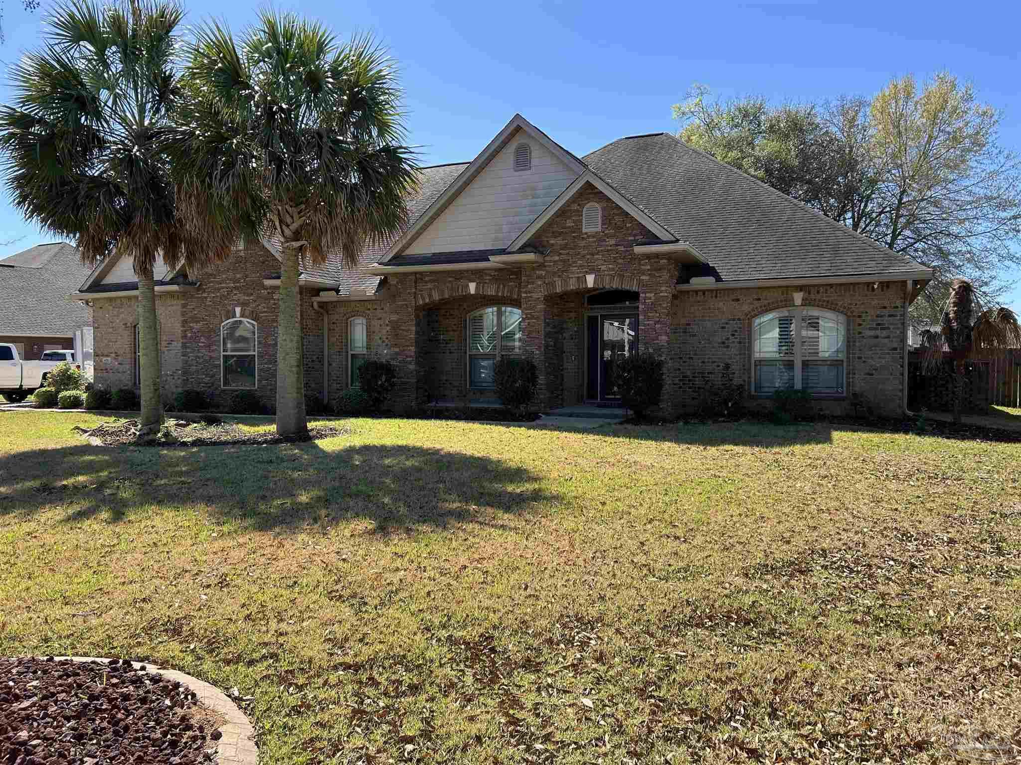 4081 Manchester Court Pace, FL 32571 - Photo 2 of 34 a front view of a house with a yard