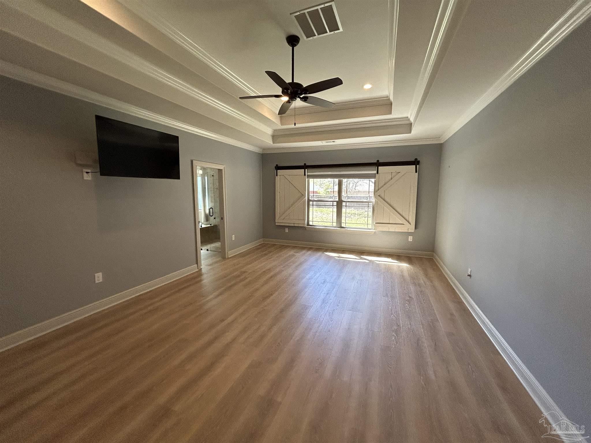 4081 Manchester Court Pace, FL 32571 - Photo 22 of 34 wooden floor in an empty room with a window