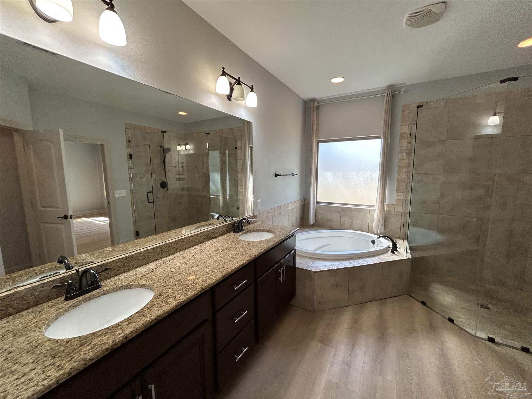 4081 Manchester Court Pace, FL 32571 - Photo 24 of 34 a bathroom with a granite countertop double vanity sink and a mirror