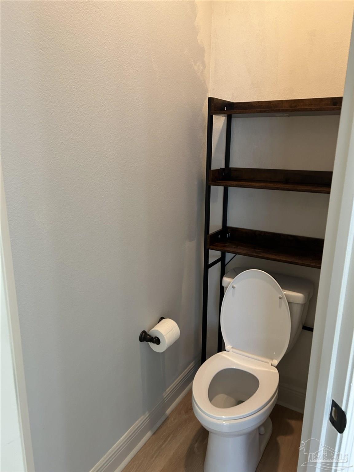 4081 Manchester Court Pace, FL 32571 - Photo 26 of 34 a close view of a toilet in a small room