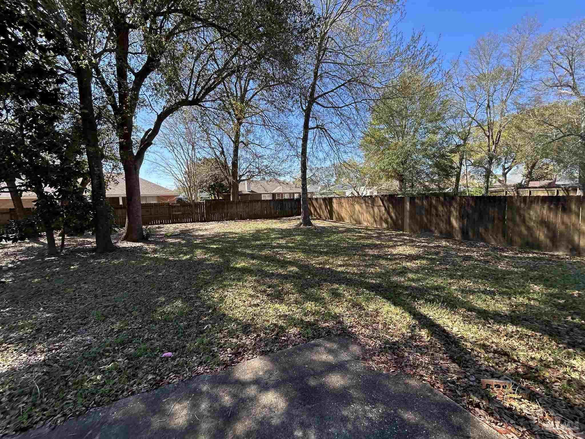 4081 Manchester Court Pace, FL 32571 - Photo 32 of 34 a view of a yard with a large tree
