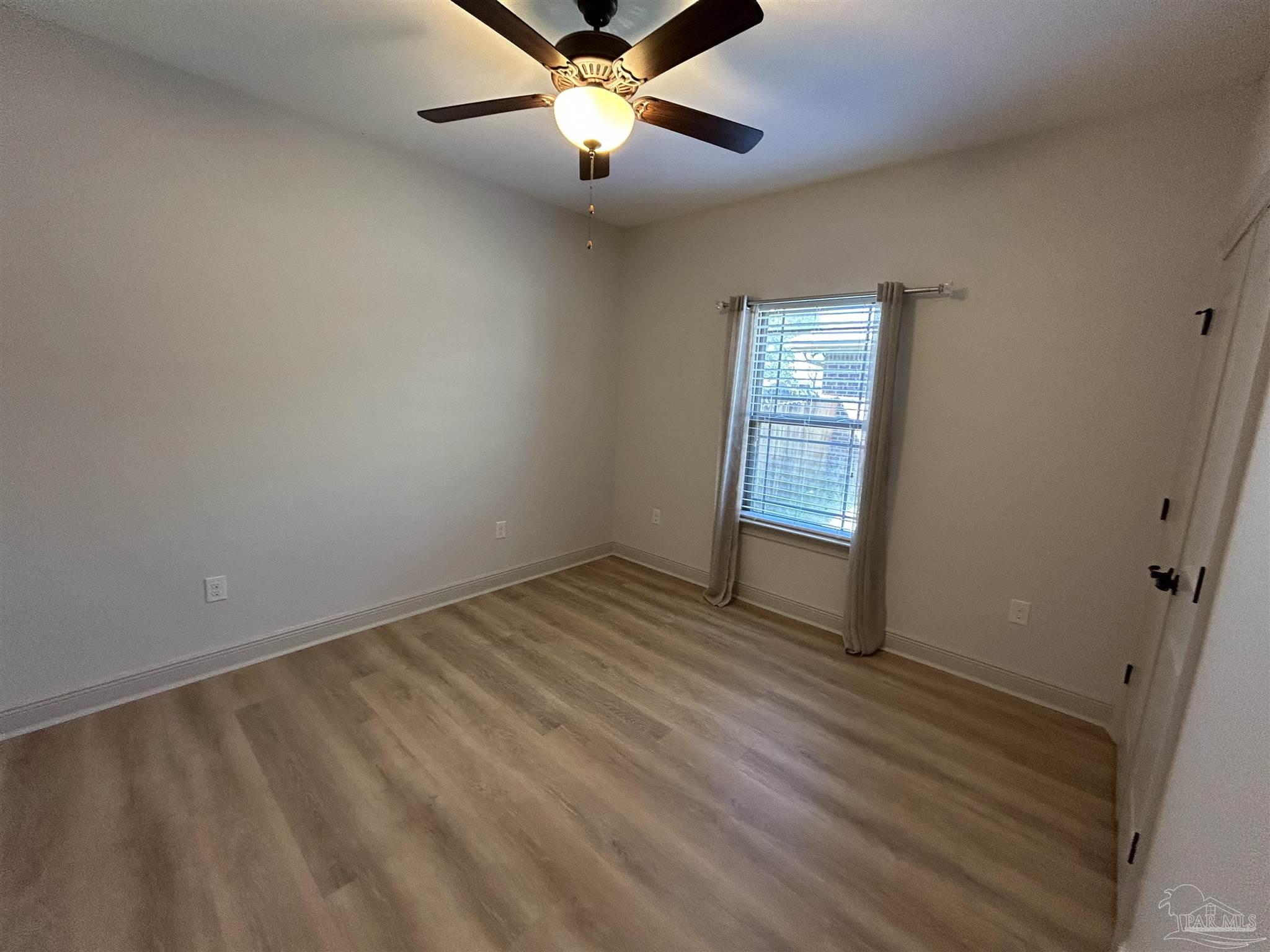 4081 Manchester Court Pace, FL 32571 - Photo 9 of 34 a view of an empty room and window