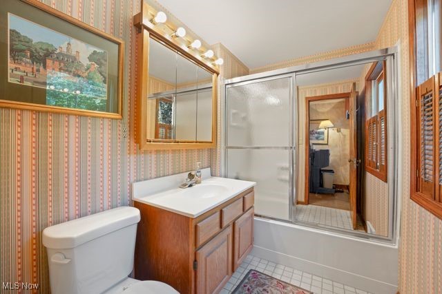 3602 Darrow Road Stow, OH 44224 - Photo 24 of 26 2nd floorFull bathroom featuring tile patterned floors, combined bath / shower with glass door, vanity, and toilet