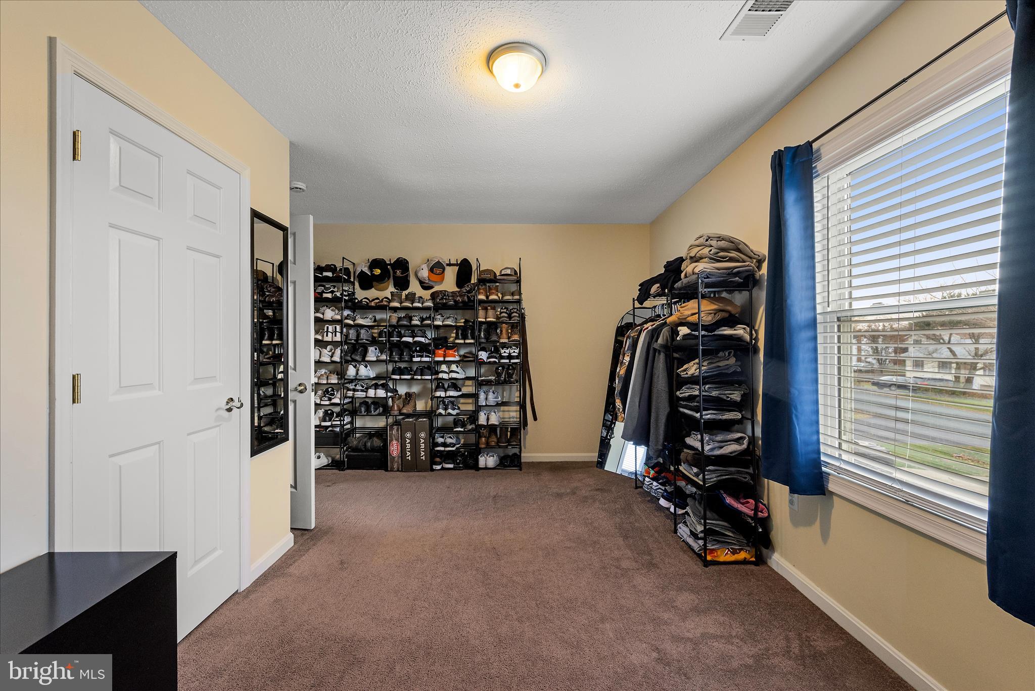 207 Killdeer Road Stephens City, VA 22655 - Photo 23 of 39 a view of walk in closet with clothes and shoes