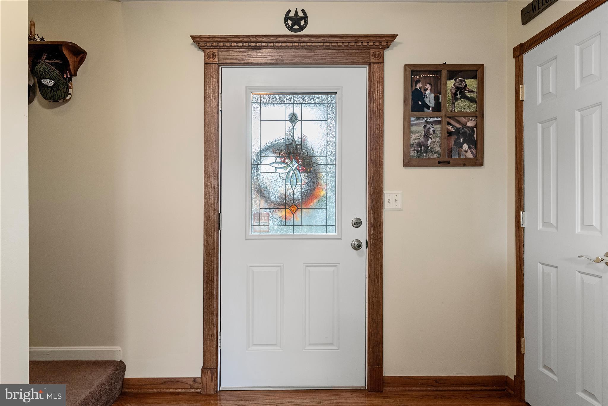 207 Killdeer Road Stephens City, VA 22655 - Photo 3 of 39 a view of a hallway with wooden floor and closet