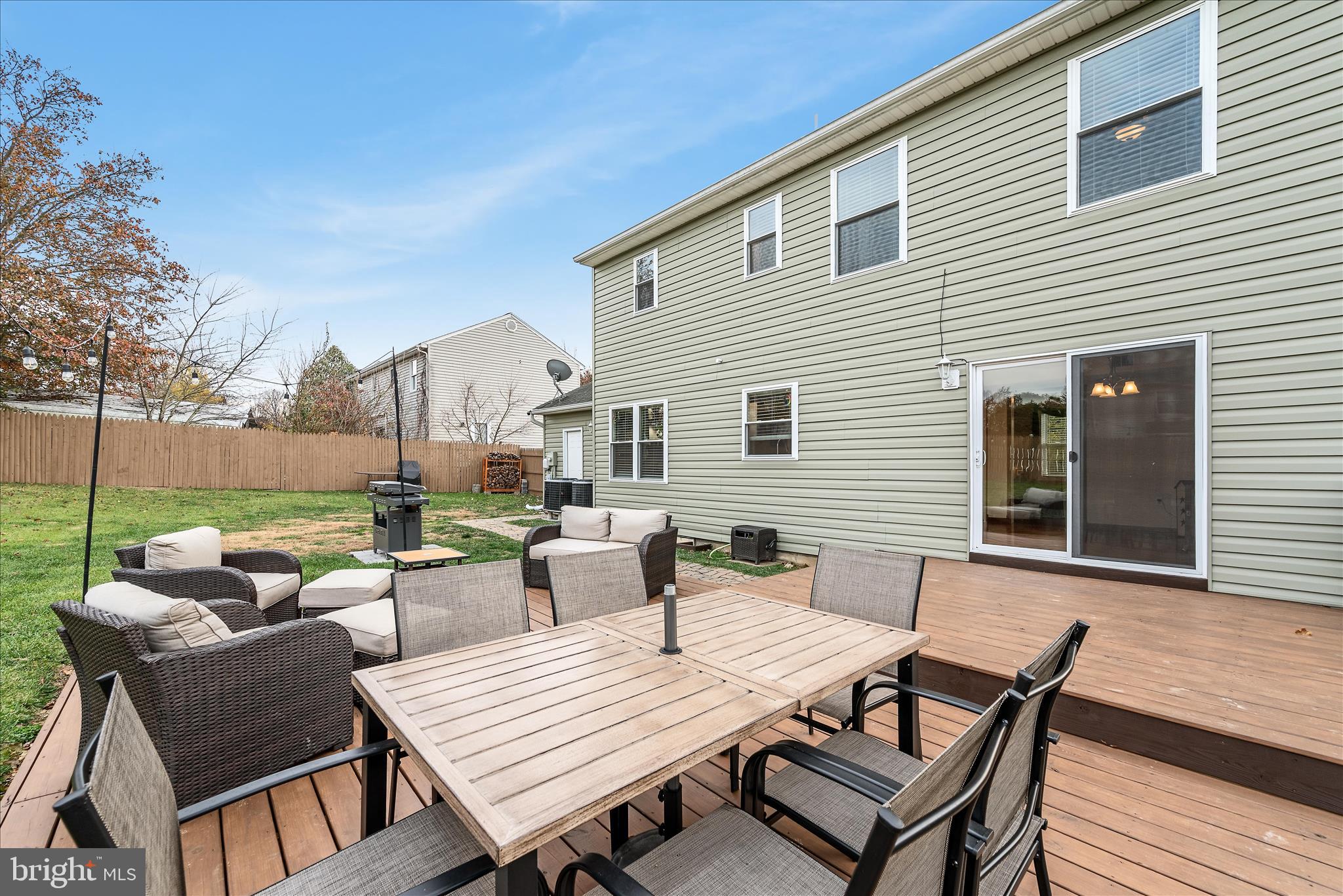 207 Killdeer Road Stephens City, VA 22655 - Photo 31 of 39 a view of a patio with a dining table and chairs with wooden floor