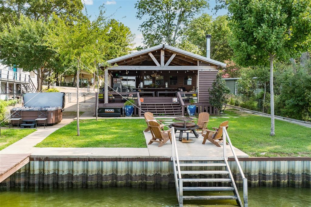 309 Shore Line Drive Tool, TX 75143 - Photo 2 of 23 a front view of a house with garden