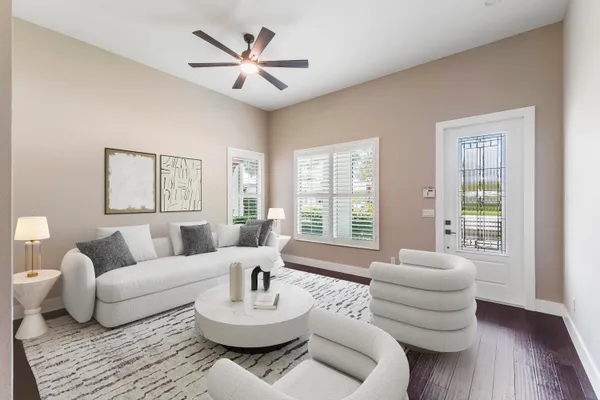 a living room with furniture and a large window