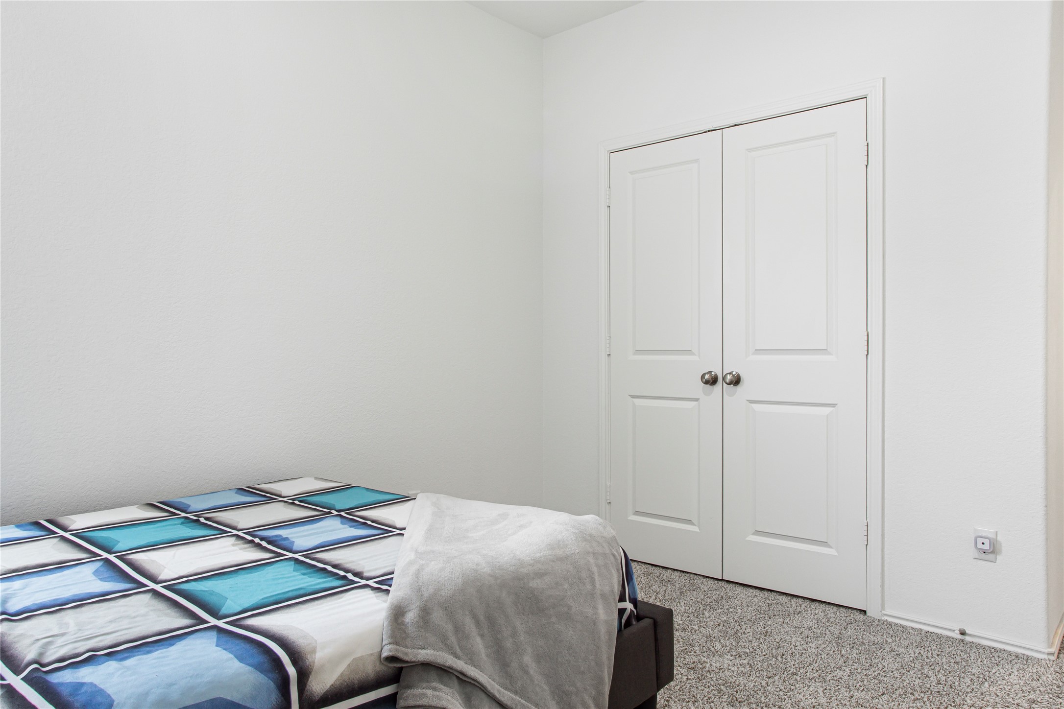 124 Cherry Ridge Road Georgetown, TX 78628 - Photo 16 of 23 Neutral wall paint, plush carpeting, and classic bi-fold closet doors characterize this space