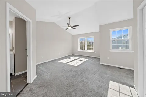 a view of empty room with windows