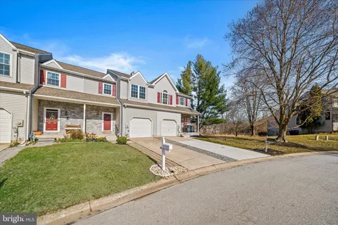 a view of house with outdoor space and porch