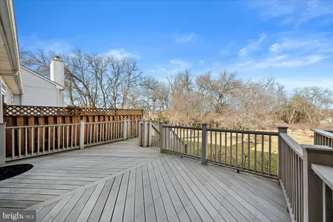 a view of a balcony with wooden fence
