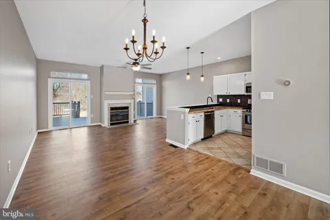 a view of a kitchen with a sink and a stove top oven