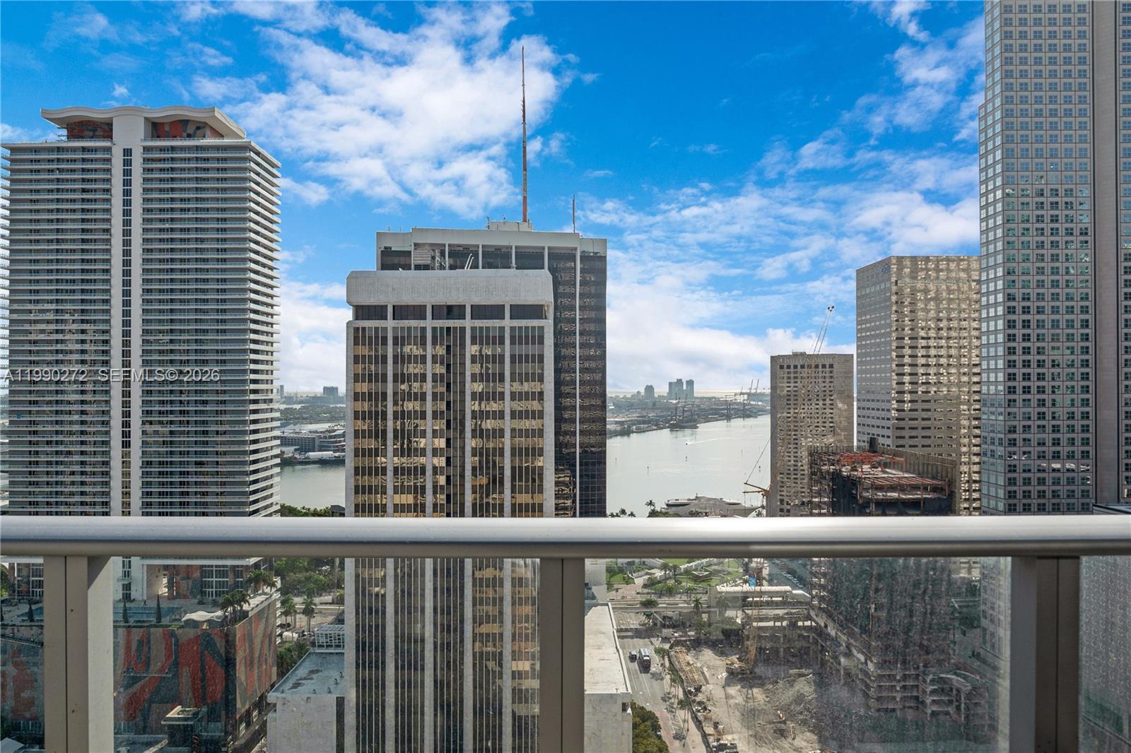 151 Southeast 1st Street, Unit 2802 Miami, FL 33131 - Photo 3 of 31 a city view from a balcony