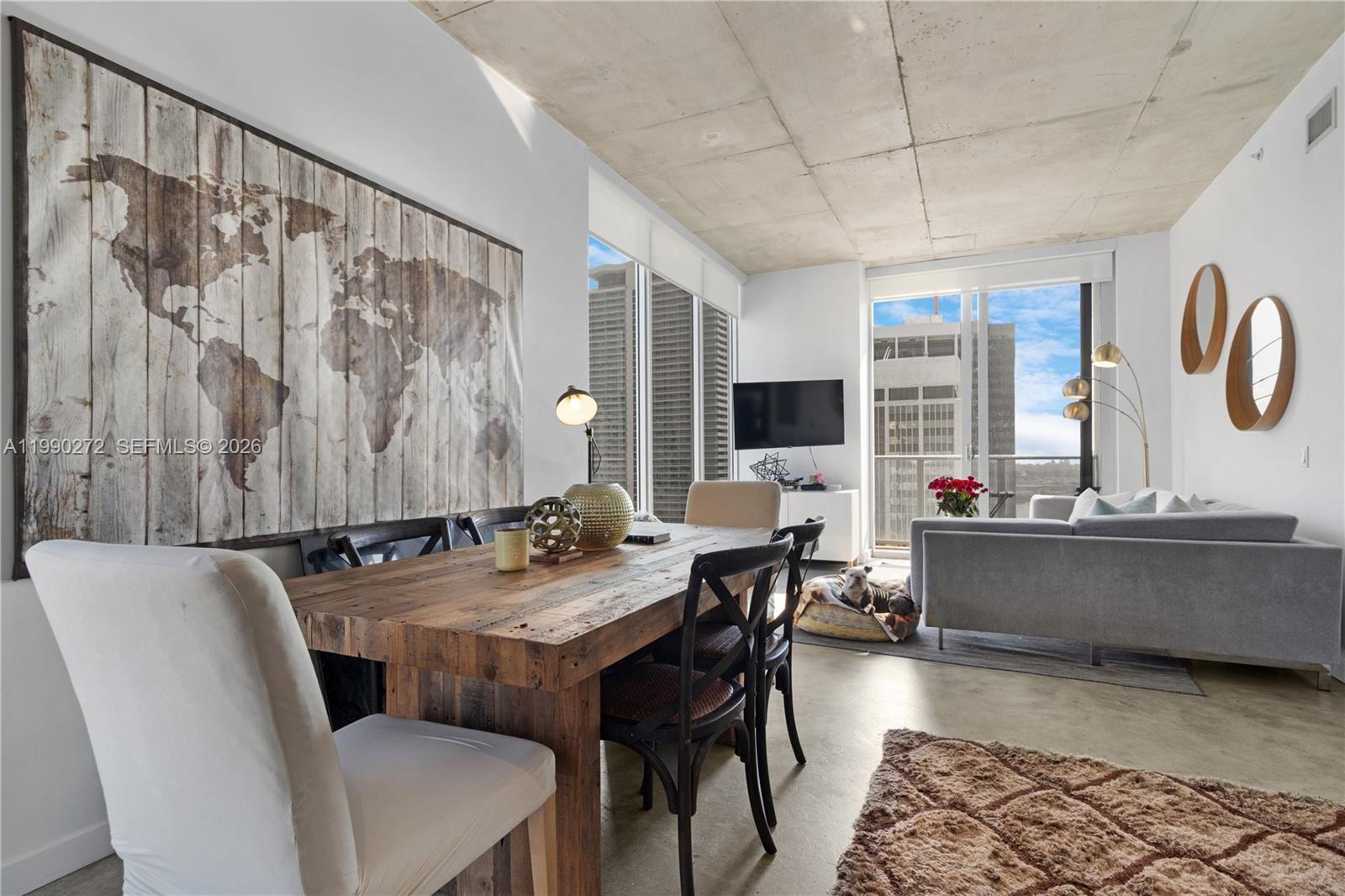 151 Southeast 1st Street, Unit 2802 Miami, FL 33131 - Photo 6 of 31 a dining room with furniture and window