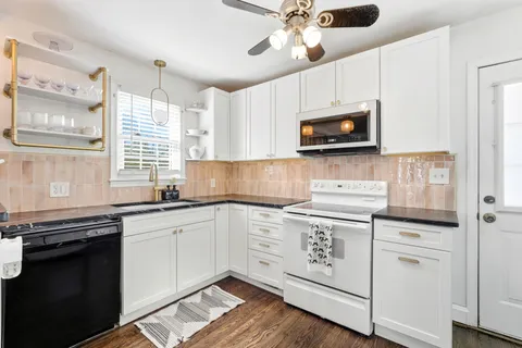 a kitchen with a stove and a microwave