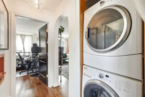 a view of a bedroom with washer and dryer