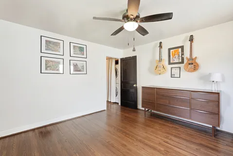 a view of room with window and wooden floor