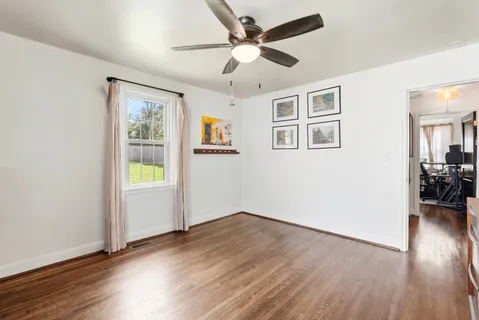 a view of livingroom with hardwood floor and a ceiling fan