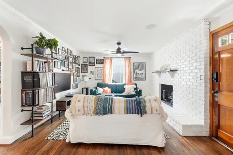 a living room with furniture and a fireplace
