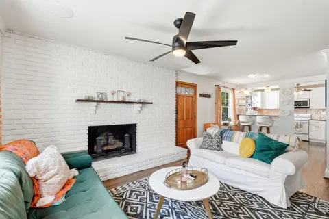 a living room with furniture and a fireplace