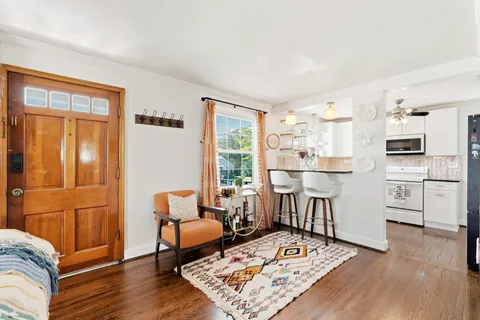 a living room with furniture and a table