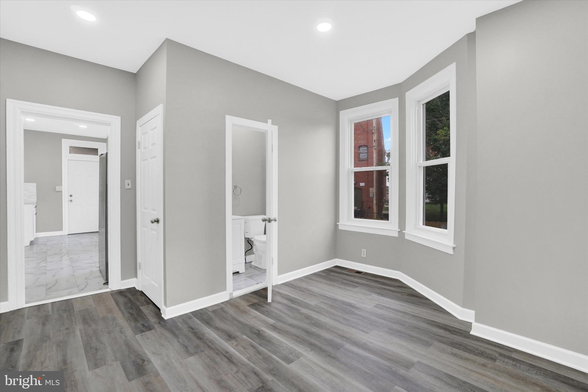 359 East Prospect Street York, PA 17403 - Photo 12 of 27 a view of an empty room with wooden floor and a window