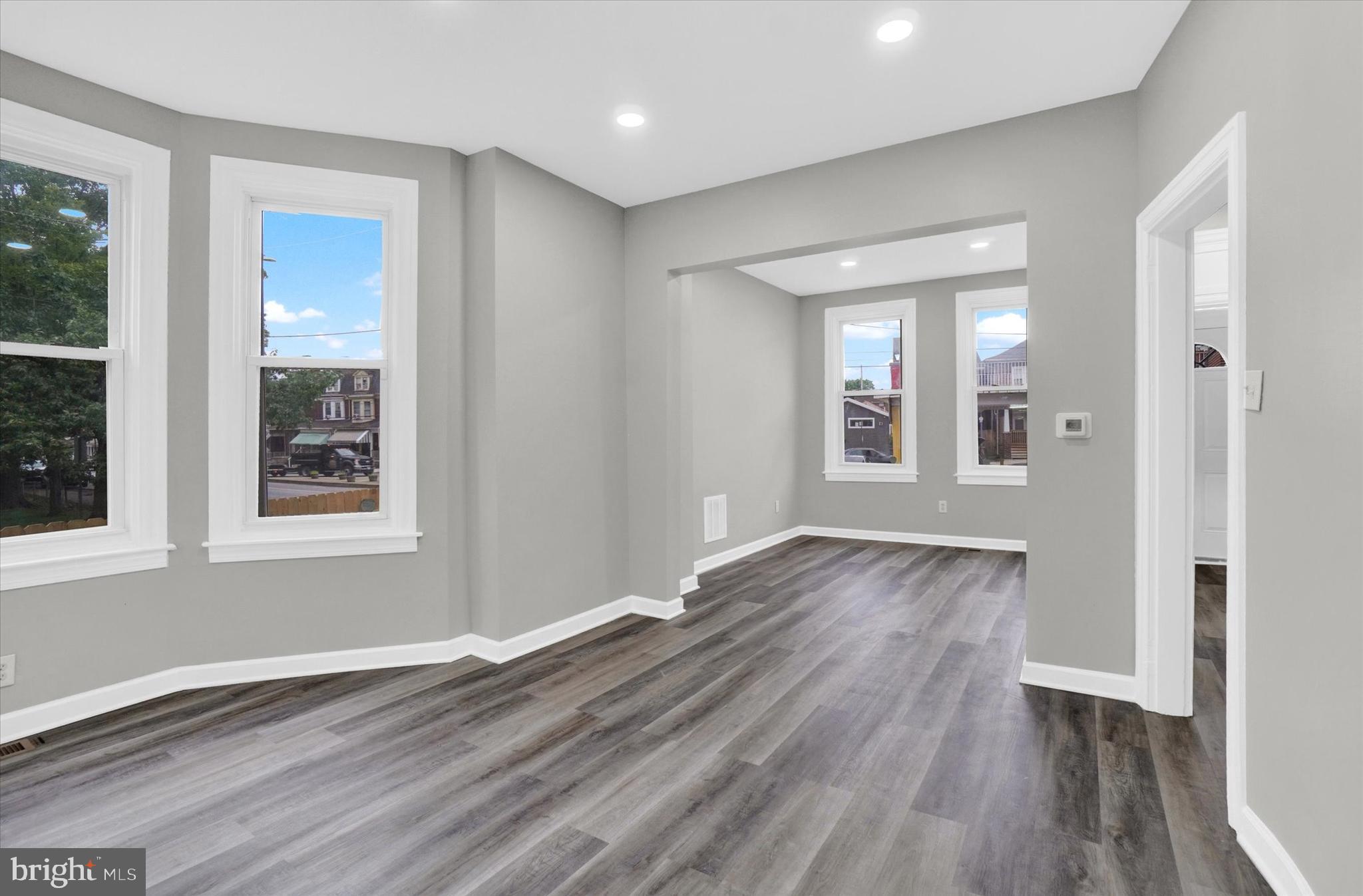 359 East Prospect Street York, PA 17403 - Photo 6 of 27 a view of an empty room with wooden floor and a window