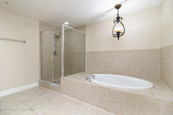 a bathroom with a bathtub and shower
