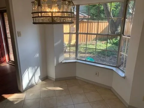 a bathroom with a bathtub and window