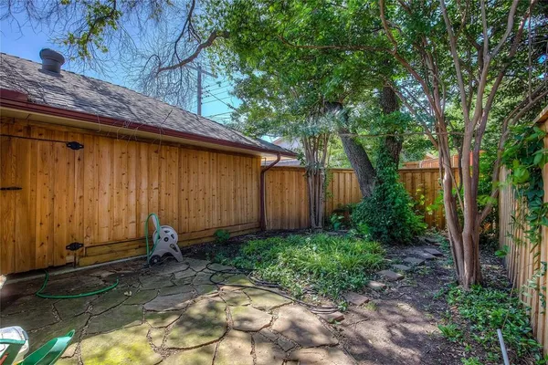 a backyard of a house with lots of green space