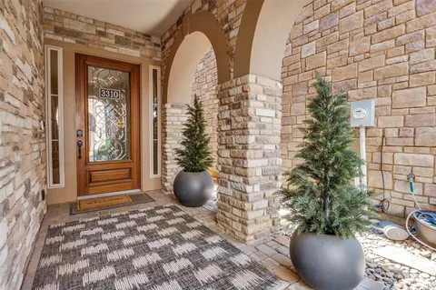 a view of a potted plant in front of a door
