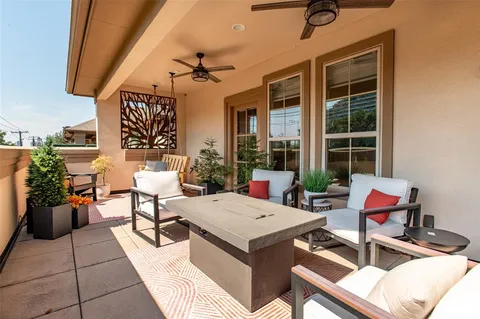 a view of a balcony with furniture
