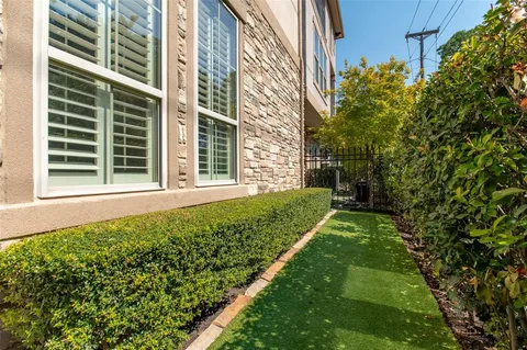 a view of a brick building with many windows