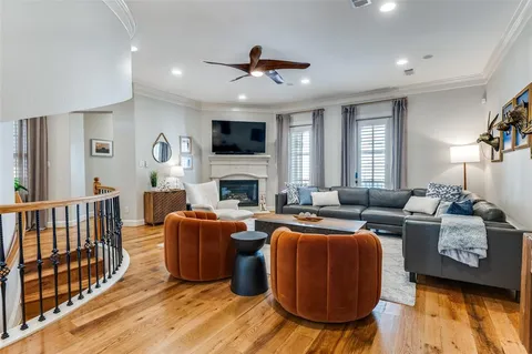 a living room with furniture fireplace and a flat screen tv