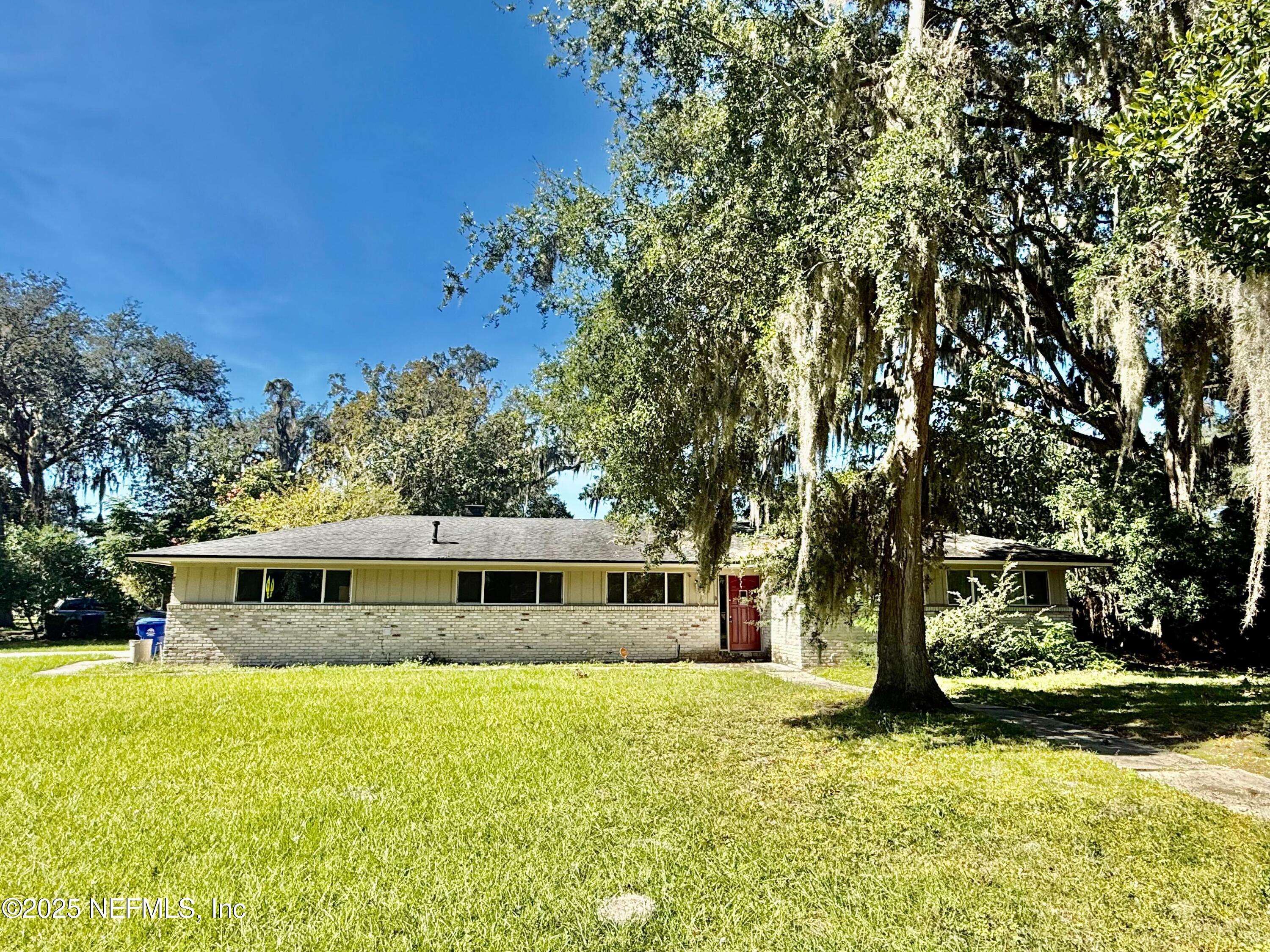 2349 Moody Avenue Orange Park, FL 32073 - Photo 1 of 10 a front view of a house with a yard
