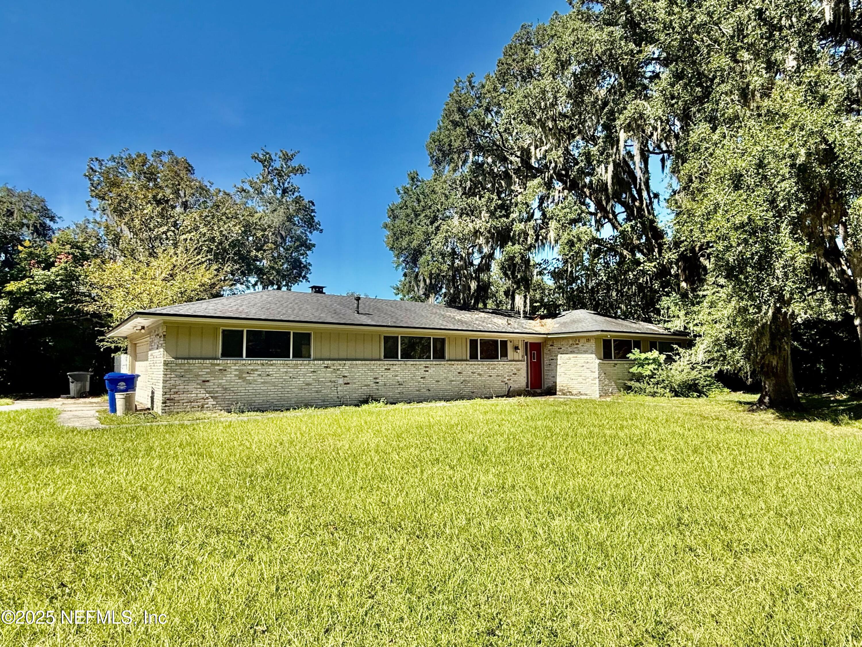 2349 Moody Avenue Orange Park, FL 32073 - Photo 2 of 10 a front view of a house with a yard