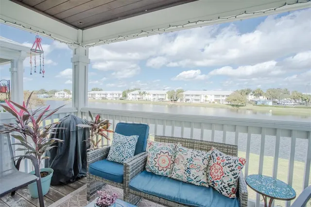 a view of a balcony with furniture